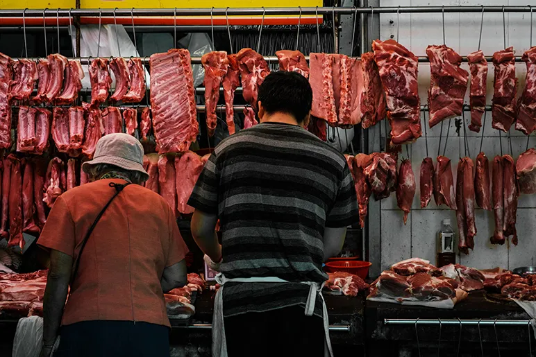 Meat hanging at street market